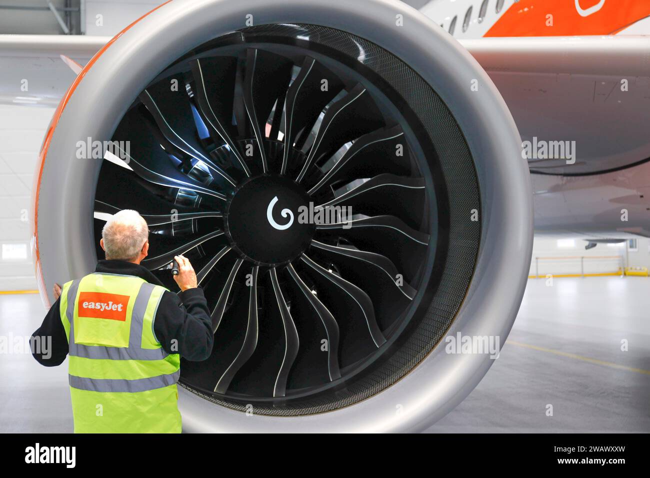 Olaf Gross, Licence Engineer at easyJet, checks the engine of an Airbus A320 Neo in front of the opening of the new easyJet maintenance hangar at Stock Photo