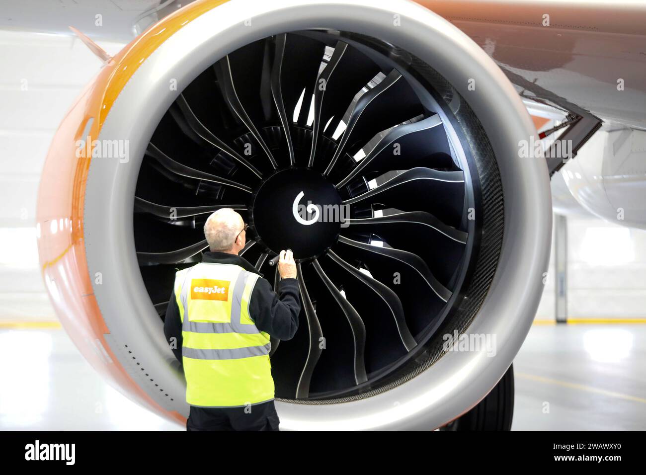 Olaf Gross, Licence Engineer at easyJet, checks the engine of an Airbus A320 Neo in front of the opening of the new easyJet maintenance hangar at Stock Photo