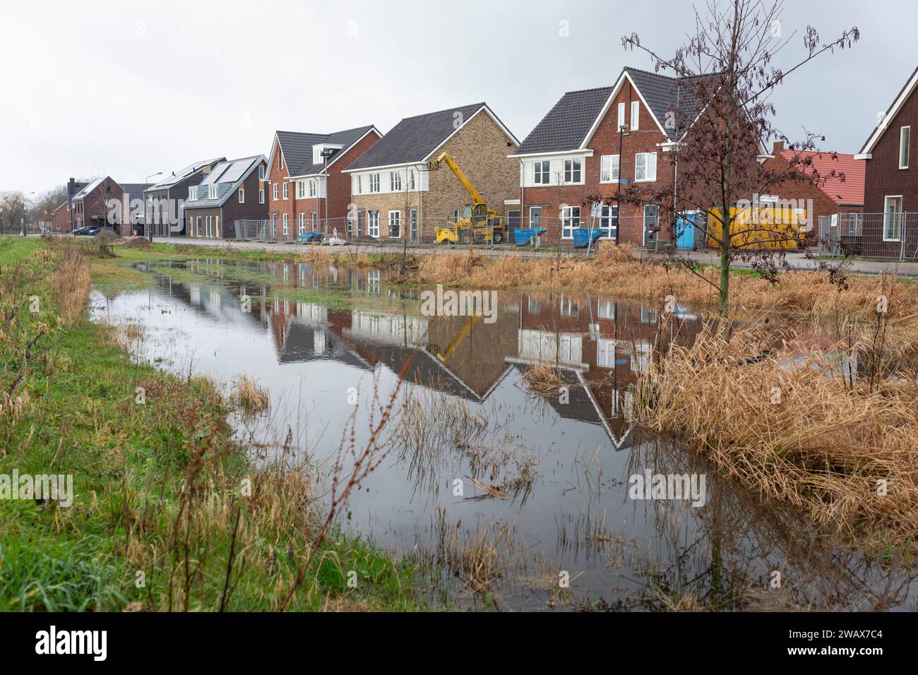 Extreme rainfall in the Netherlands in December 2023 with flooded park in a residential l area Stock Photo