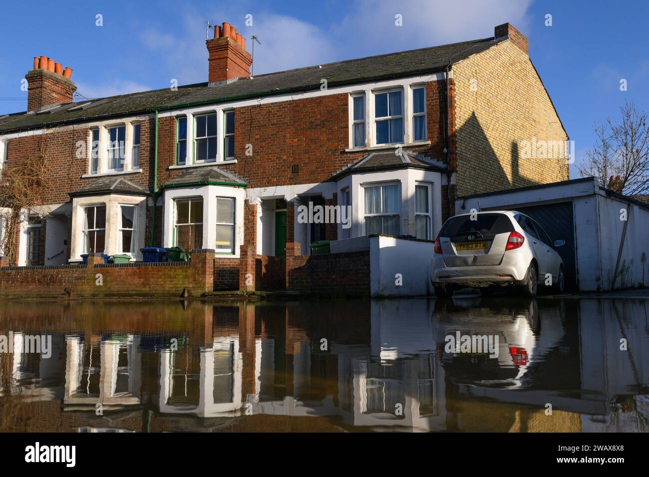 Terraced houses reflected in flood waters Helen Road, Oxford