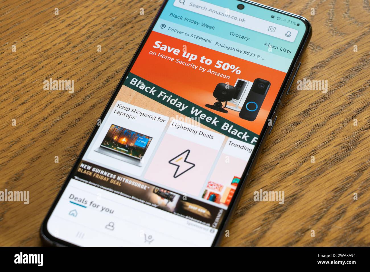 Black Friday Week with big savings advertising banner and page from the Amazon shopping app on a smartphone screen, UK Stock Photo