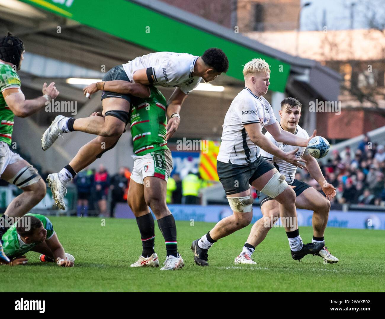 Leicester Tigers Solomone Kata holds up Saracens Theo McFarland while Huge Tizzard make a break with the ball during the Leicester Tigers vs Saracens, Mattioli Woods, Welford Road Stadium, Leicester UK on Saturday 6th January 2023. Photo by Gary Mitchell Stock Photo