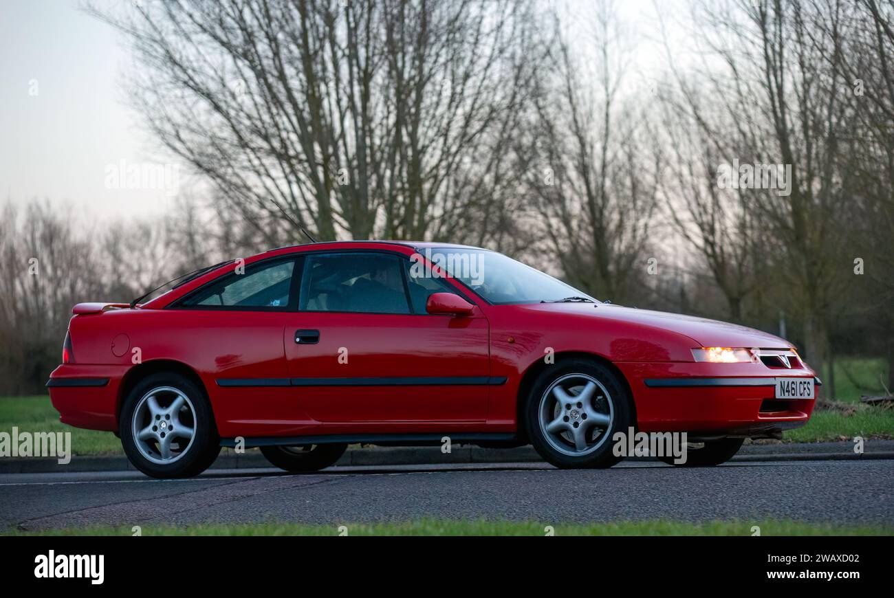 Stony Stratford,UK Jan 1st 2024. 1995 red Vauxhall Calibra car arriving at Stony Stratford for the annual New Years Day vintage and classic vehicle fe Stock Photo