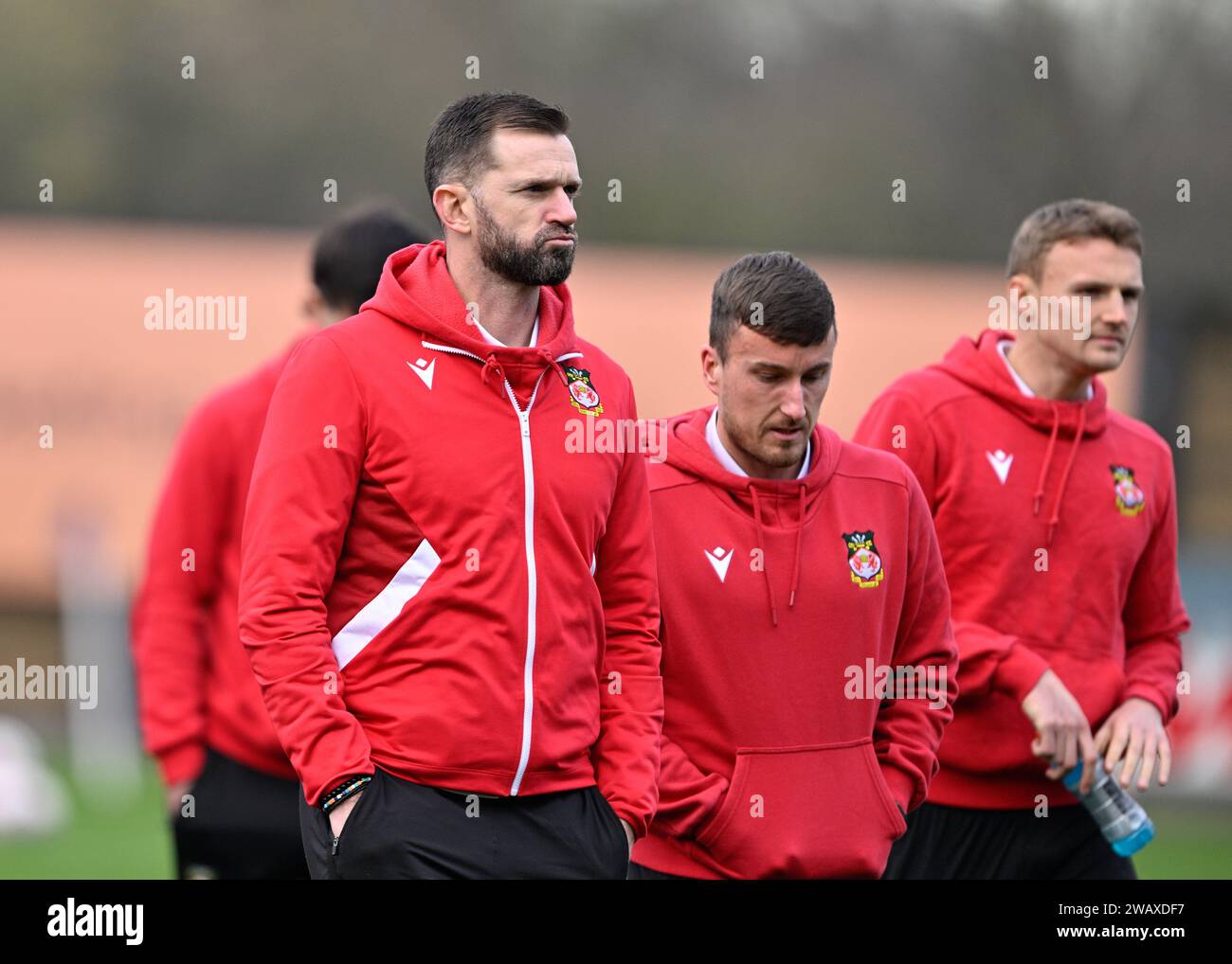 Mark Howard of Wrexham inspects the pitch ahead of the match, during