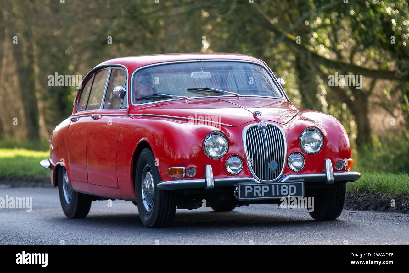 Stony Stratford,UK Jan 1st 2024. 1966 red Jaguar S-Type 3.8 litre car arriving at Stony Stratford for the annual New Years Day vintage and classic veh Stock Photo