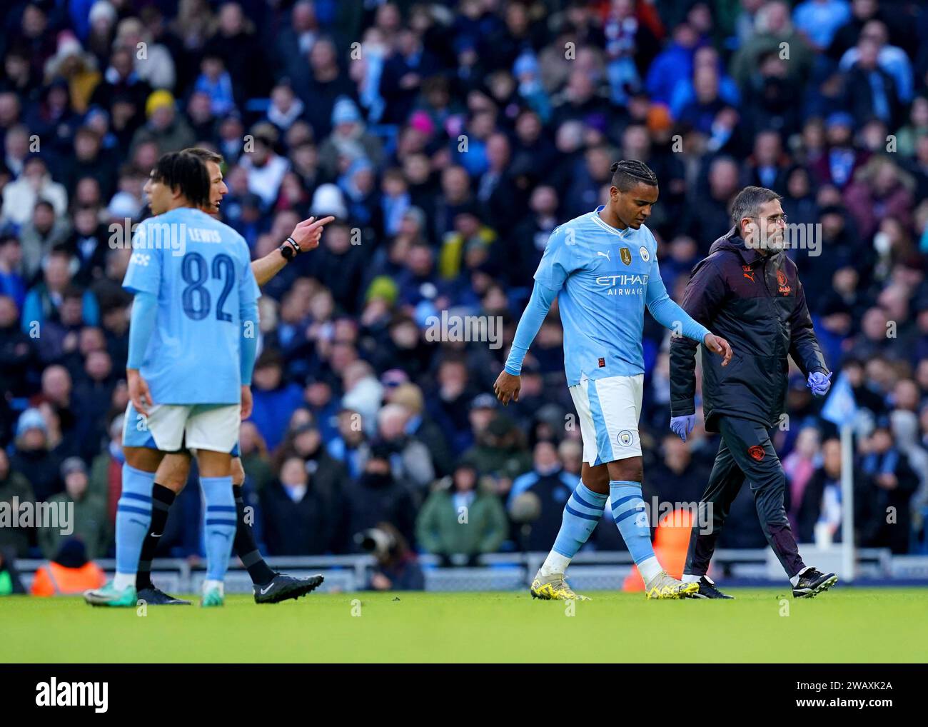 Manchester City's Manuel Akanji leaves the pitch after picking up an