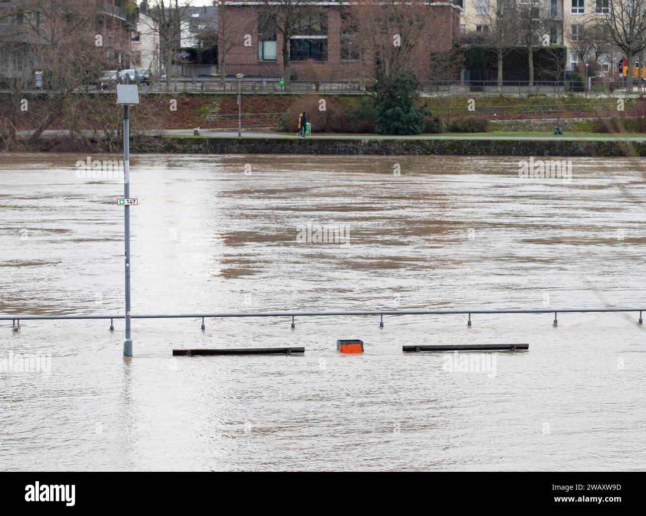 Frankfurt, Germany. 7th Jan, 2024. Benches along the Main River are submerged in flood water in Frankfurt, Germany, Jan. 7, 2024. Some areas in Frankfurt were flooded due to continuous rainfall and rising water level of the Main River. Credit: Zhang Fan/Xinhua/Alamy Live News Stock Photo