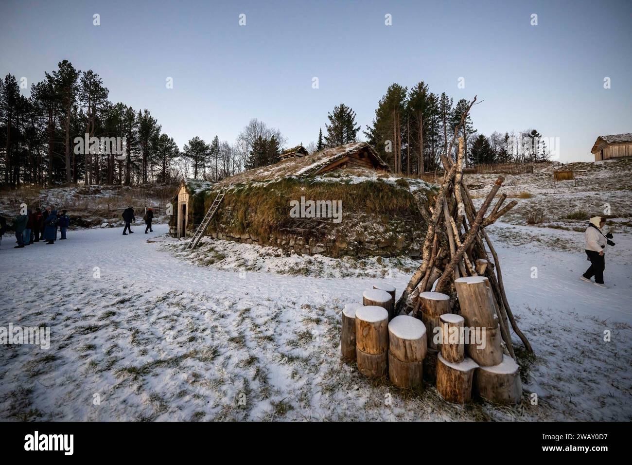 Berg, Norway. 13th Nov, 2023. People walk around a traditional Sami house during a visit to the medieval village, located on the grounds of the historical center of the city of Trondenes. The Trondenes Historical Center houses a large collection of historical artifacts and collections ranging from the first Viking settlement in the region to the occupation of Nazi Germany during World War II. It also has a medieval village display depicting the daily life and artifacts used by the Sami tribe on Norwegian soil. (Photo by Jorge Castellanos/SOPA Images/Sipa USA) Credit: Sipa USA/Alamy Live News Stock Photo