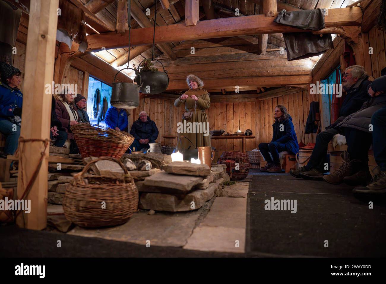 A woman dressed in Sami clothes shows some ways of preserving products ...