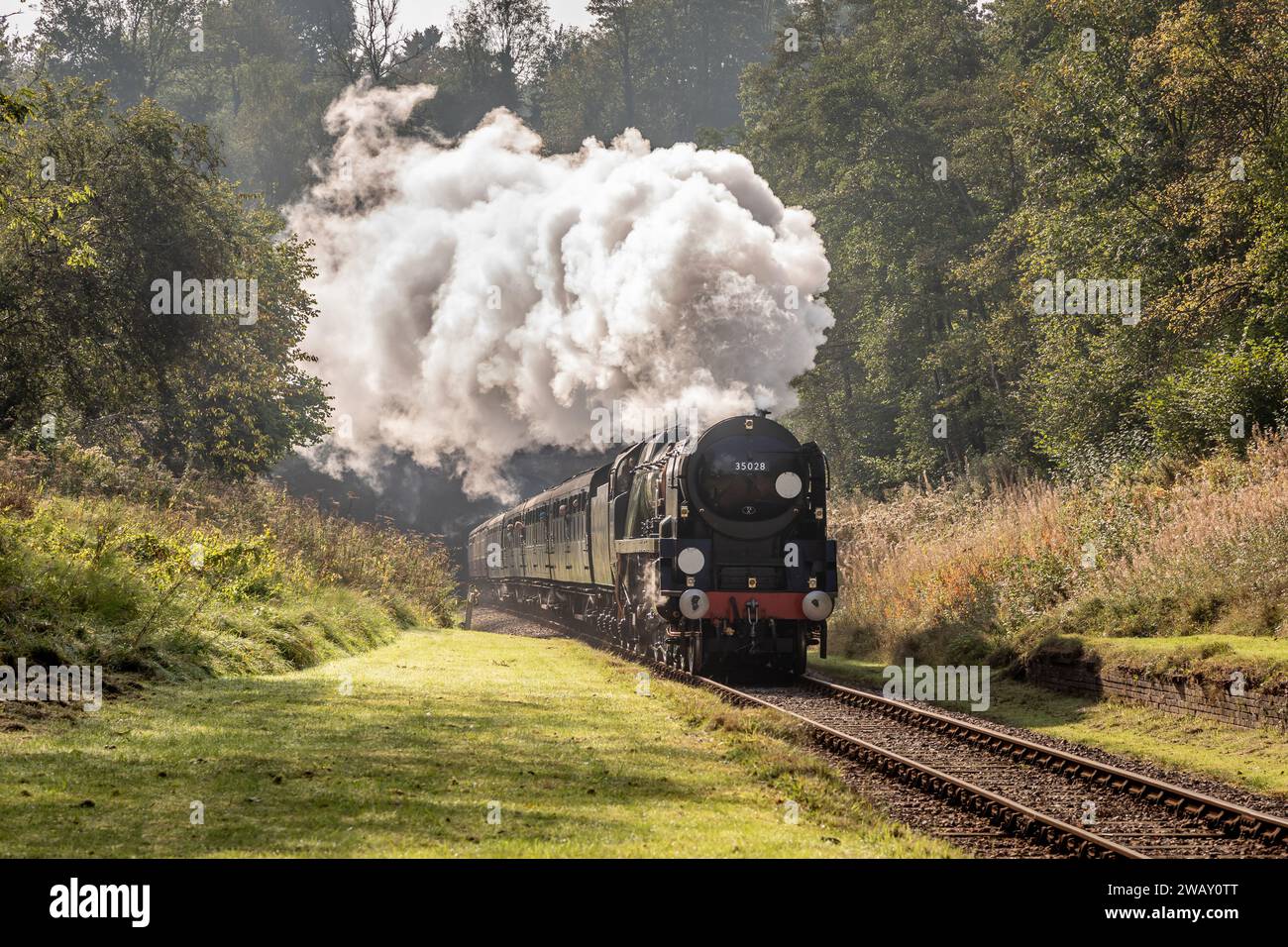 BR 'Merchant Navy' 4-6-2 No. 35028 'Clan Line' passes the site of West Hoathly station on the Bluebell Railway during their Giants of Steam Gala Stock Photo
