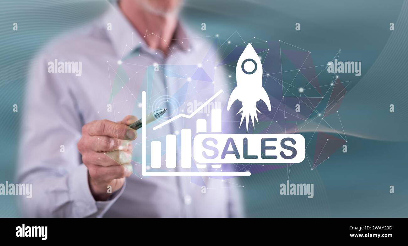 Man touching a sales growth concept on a touch screen with a pen Stock Photo