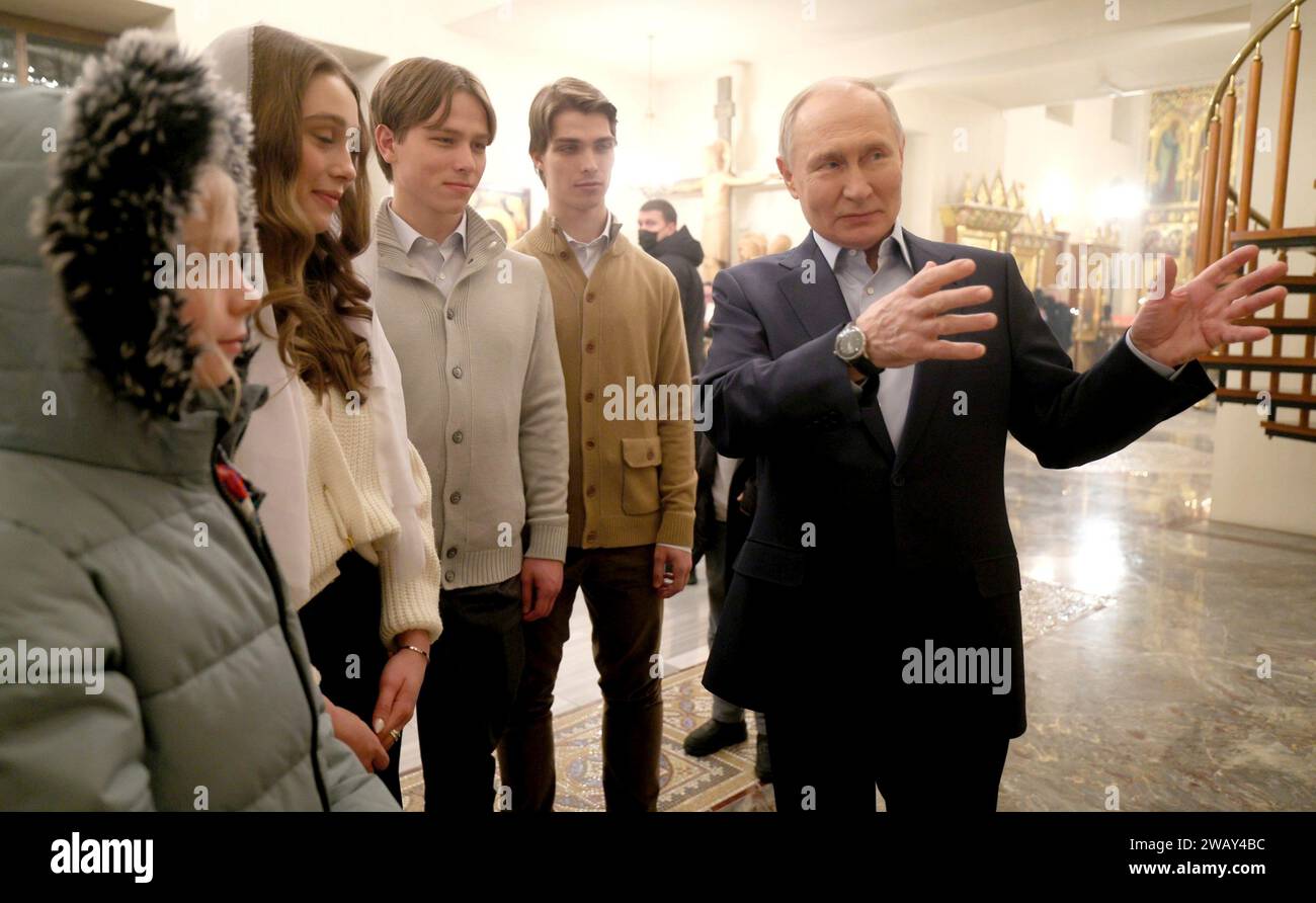 Novo-Ogaryovo, Russia. 07th Jan, 2024. Russian President Vladimir Putin meets with military family members for Orthodox Christmas celebrations at the Church of the Icon of Savior Not Made by Hands at the official presidential compound, January 7, 2024 in Novo-Ogaryovo, Moscow Oblast, Russia. Putin hosted families of soldiers killed in the Ukraine war for the celebration. Credit: Gavriil Grigorov/Kremlin Pool/Alamy Live News Stock Photo