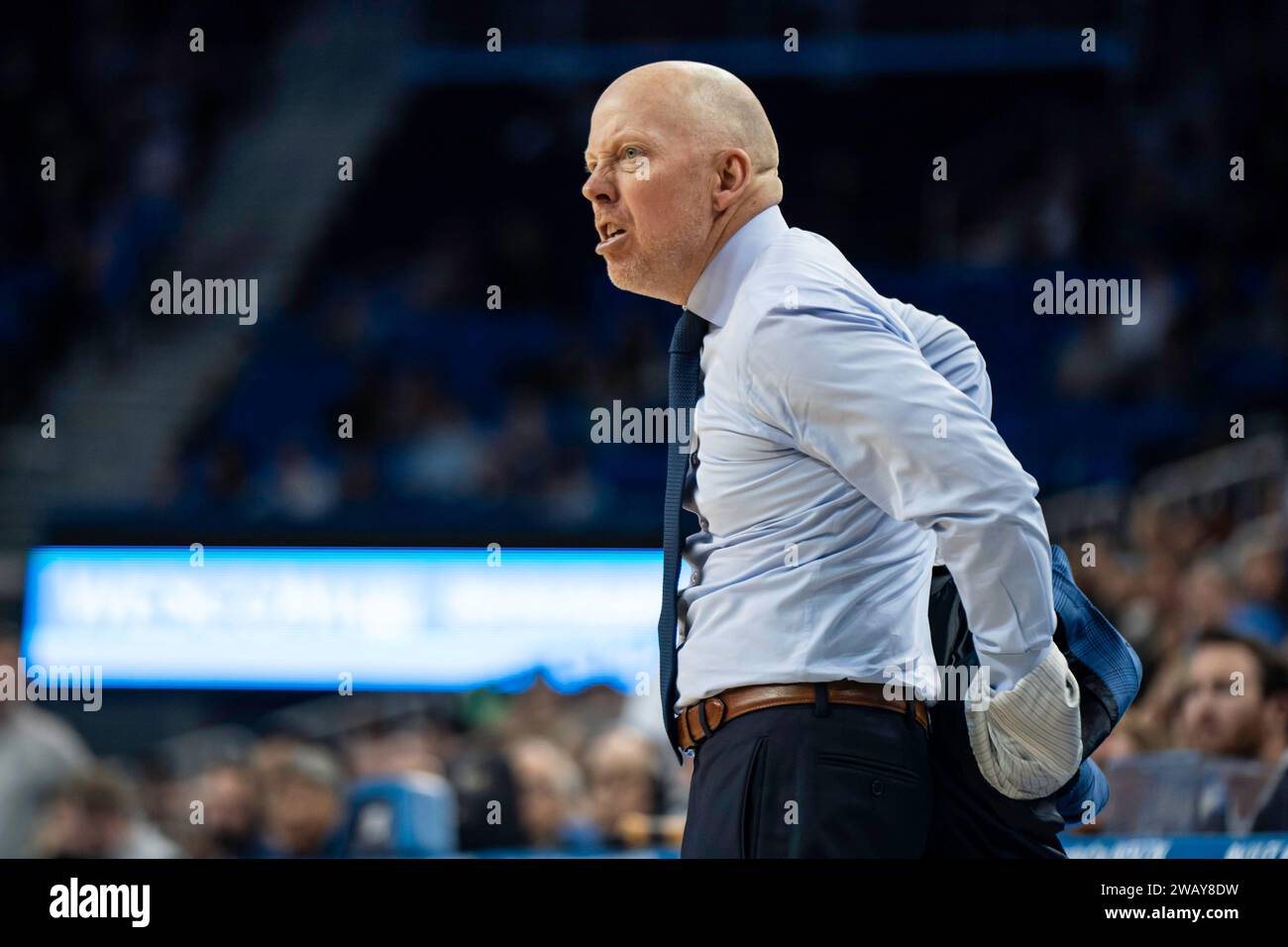 UCLA Bruins head coach Mick Cronin takes off his jacket un frustration during a NCAA basketball game against the California Golden Bears, Saturday, Ja Stock Photo