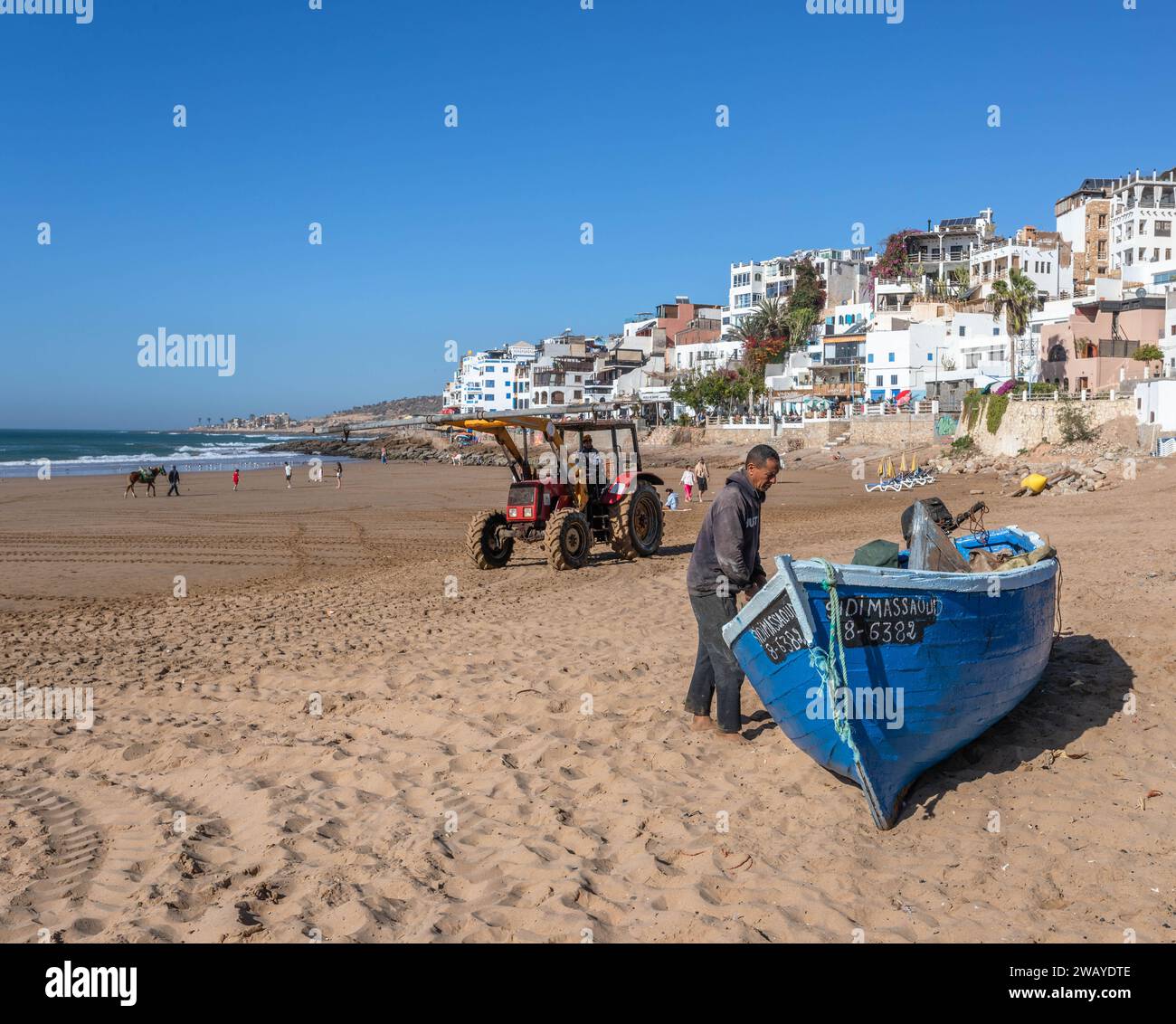 Small, Blue, Wooden Fishing Boats on the Beach in Taghazout, Morocco, North Africa Stock Photo