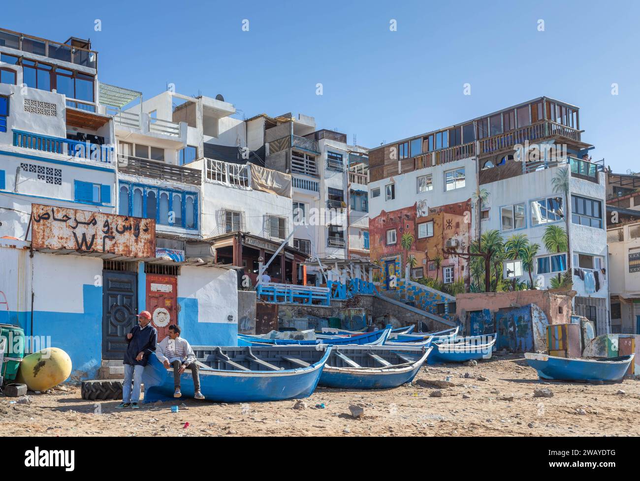 Small, Blue, Wooden Fishing Boats on the Beach in Taghazout, Morocco, North Africa Stock Photo