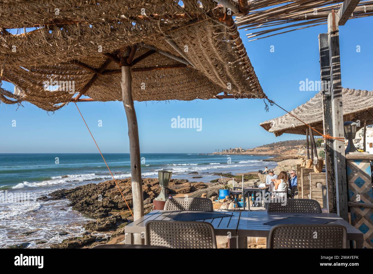 View of the Atlantic Ocean from a beach front cafe in Taghazout, Morocco. Stock Photo