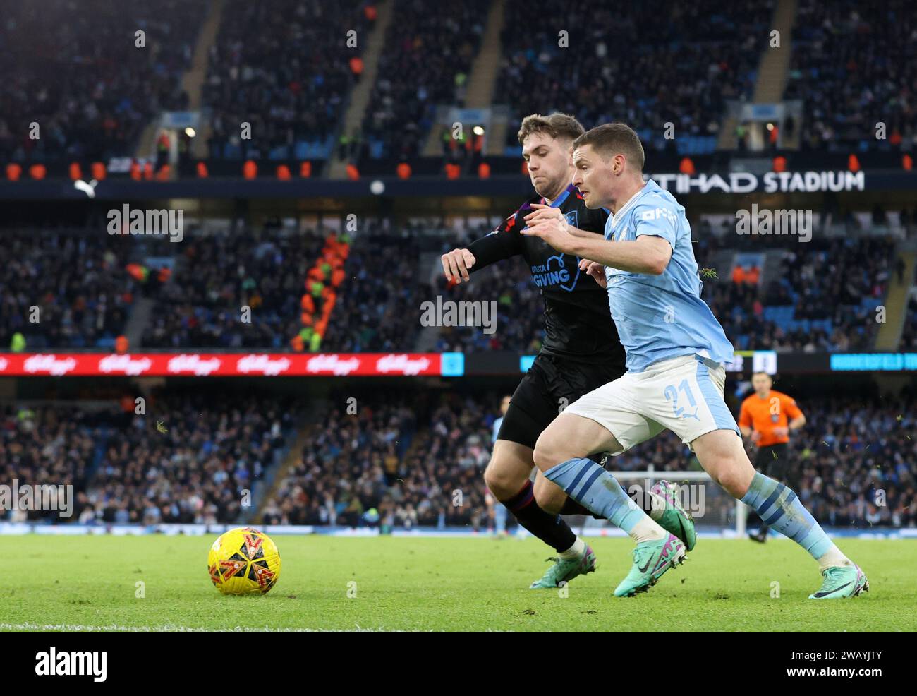 Etihad Stadium, Manchester, UK. 7th Jan, 2024. FA Cup Third Round Football, Manchester City versus Huddersfield Town; Sergio Gomez of Manchester City takes on Ben Jackson of Huddersfield Town Credit: Action Plus Sports/Alamy Live News Stock Photo