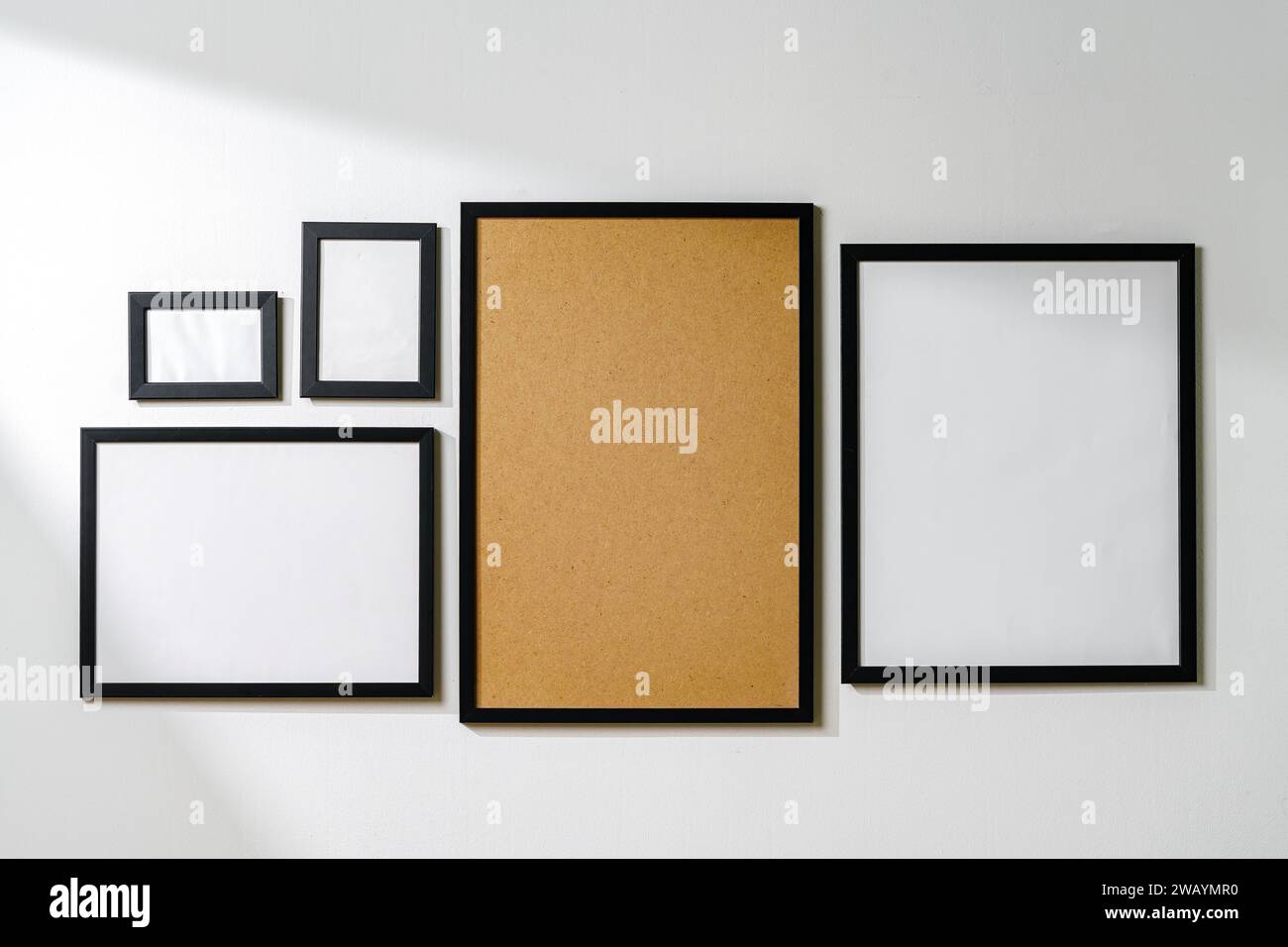Set of black frames on white wall with copy space Stock Photo