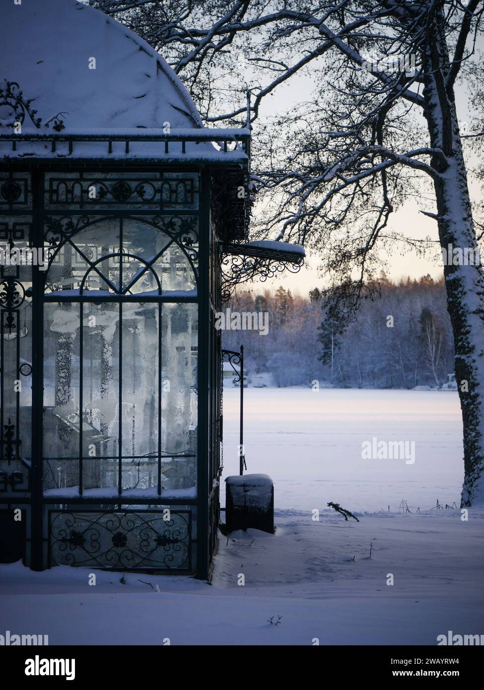 part of an old gazebo by a lake during winter Stock Photo - Alamy