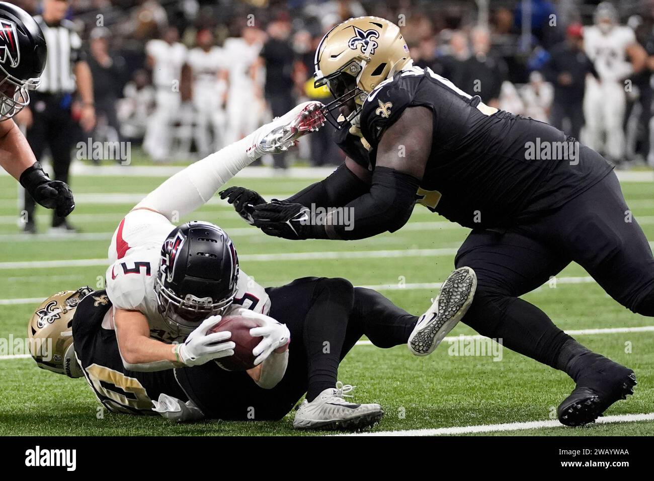 Atlanta Falcons wide receiver Drake London (5) is stopped short of the