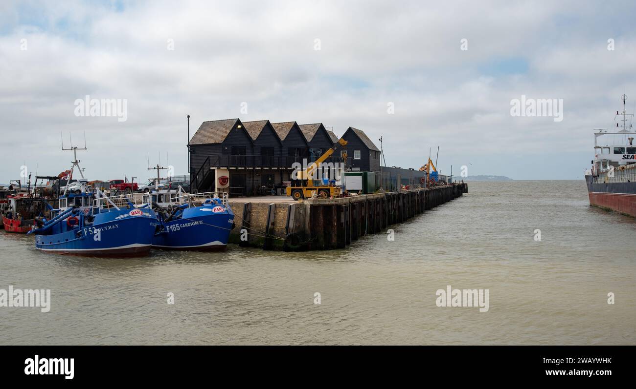 Fishing boats moored at Whitstable harbor in Kent England Stock Photo ...