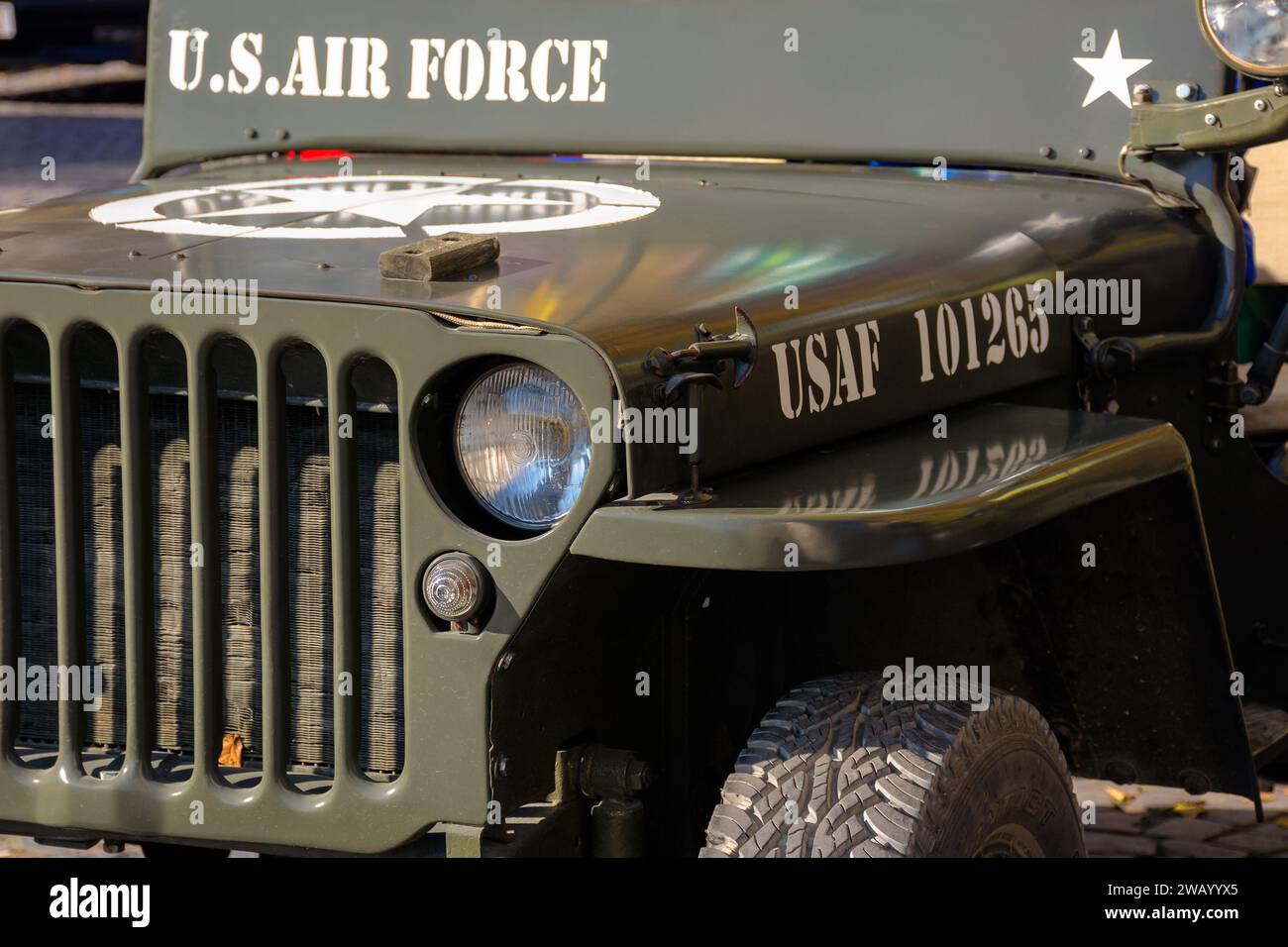uzhgorod, ukraine - 31 oct 2021: close-up of a military vehicle grille and headlights. old us air force jeep with star on the hood Stock Photo