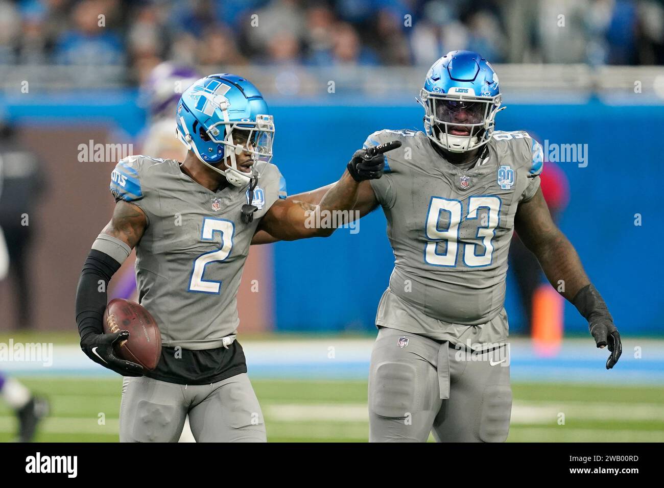 Detroit Lions safety C.J. GardnerJohnson (2) points after intercepting