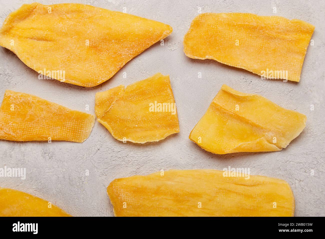 Naturally sweet - showcase of gourmet dried mango photography background. Stock Photo