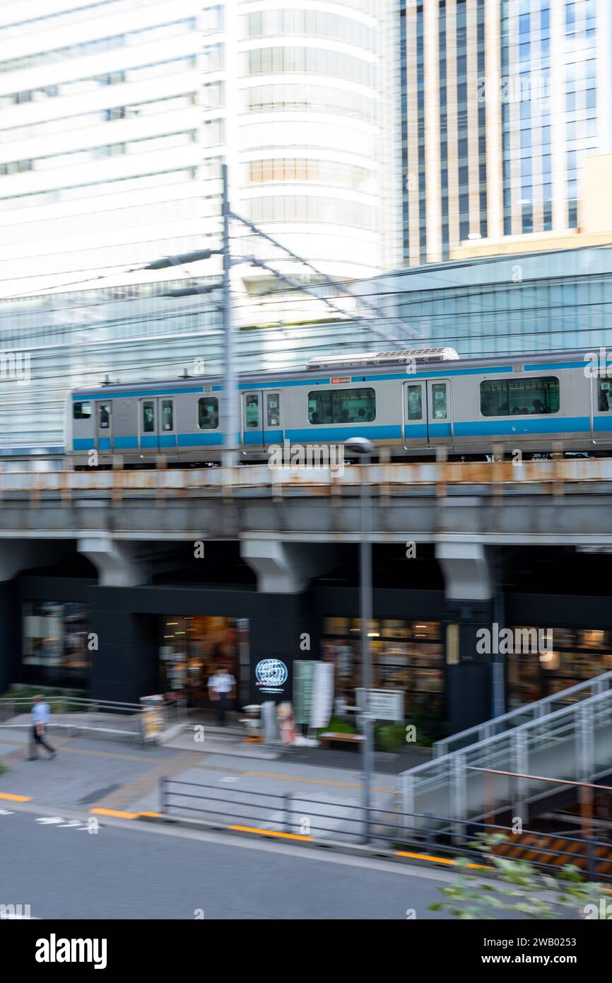train coming into the station with a blured motion on the surrounding environment Stock Photo