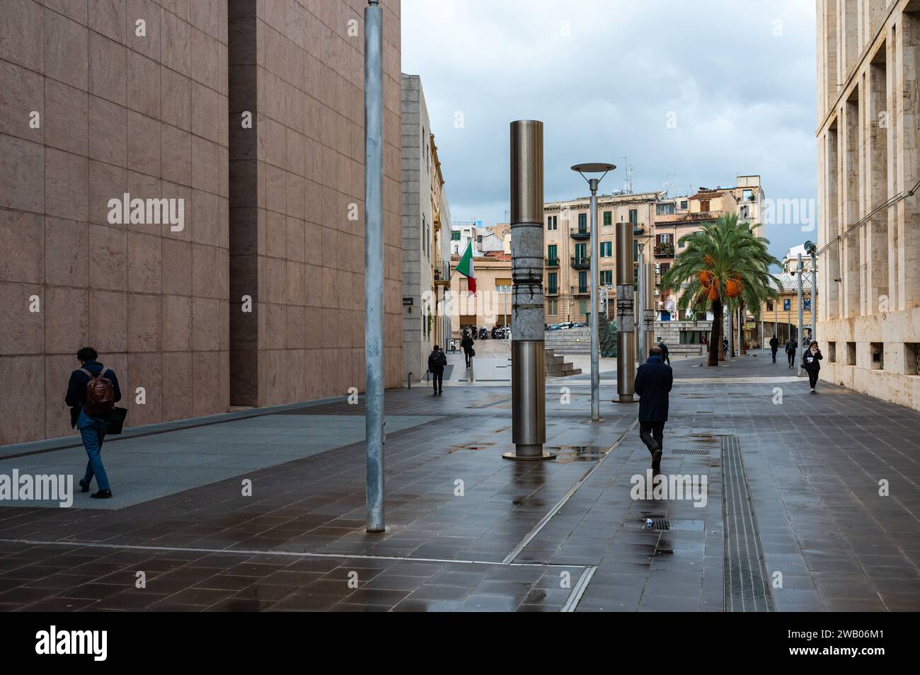 Palermo, Sicily, Italy, 15 December 2023 - The court house reflecting in the surface of the wet floor Stock Photo