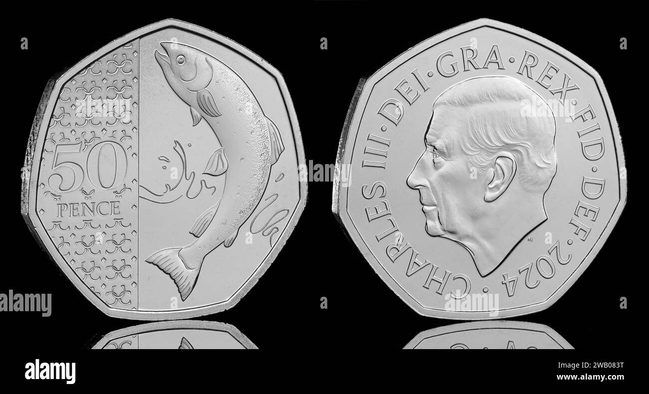 The Arctic Salmon 50 pence coin taken from the Definitive Annual Coin Set featuring the first coin portrait of King Charles III by Martin Jennings Stock Photo
