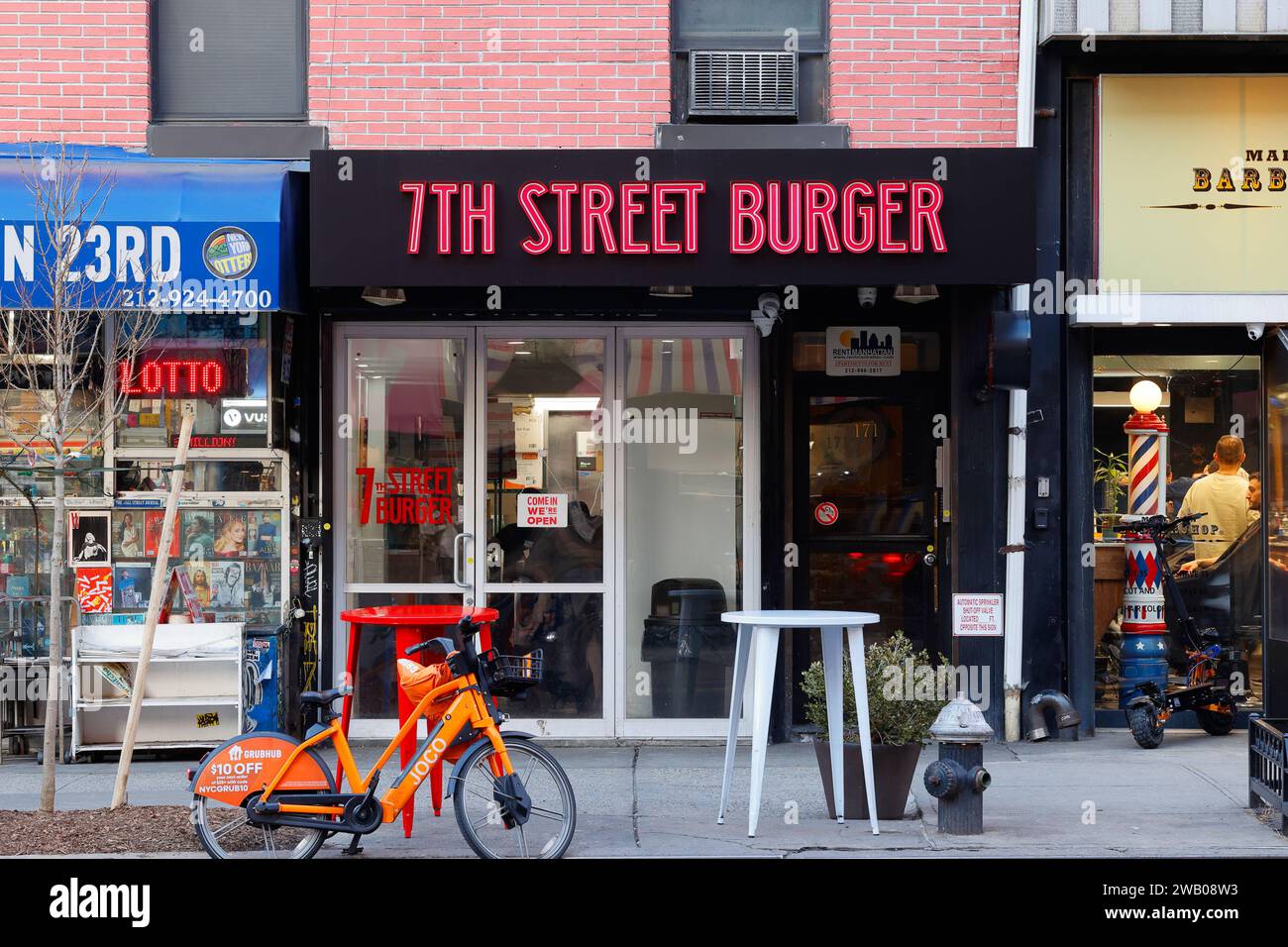 7th Street Burger, 171 W 23rd St, New York, NYC storefront photo of a fast food smash burger restaurant in Manhattan's Chelsea neighborhood. Stock Photo