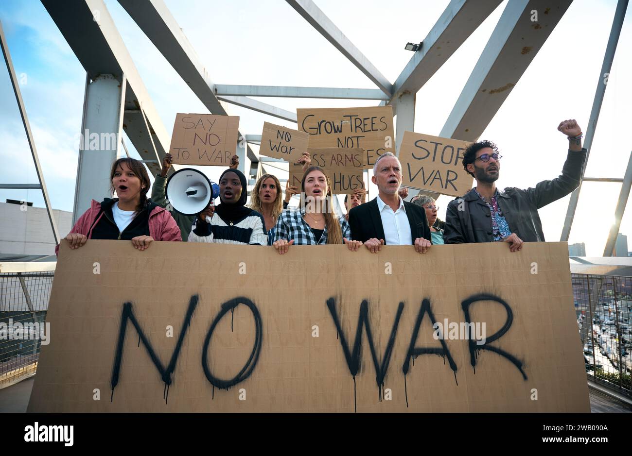 Multiracial diverse ages people protesting against war and violence in the world. Group of activists Stock Photo