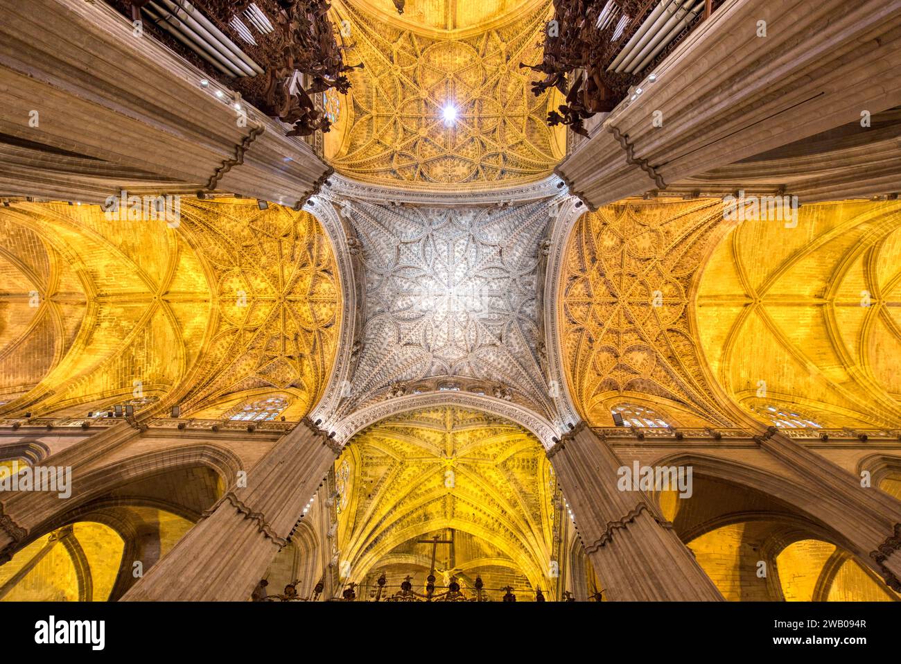 The ornate ceiling and arches of the Cathedral of Sevilla.  The 15th century cathedral is a UNESCO World Heritage Stock Photo