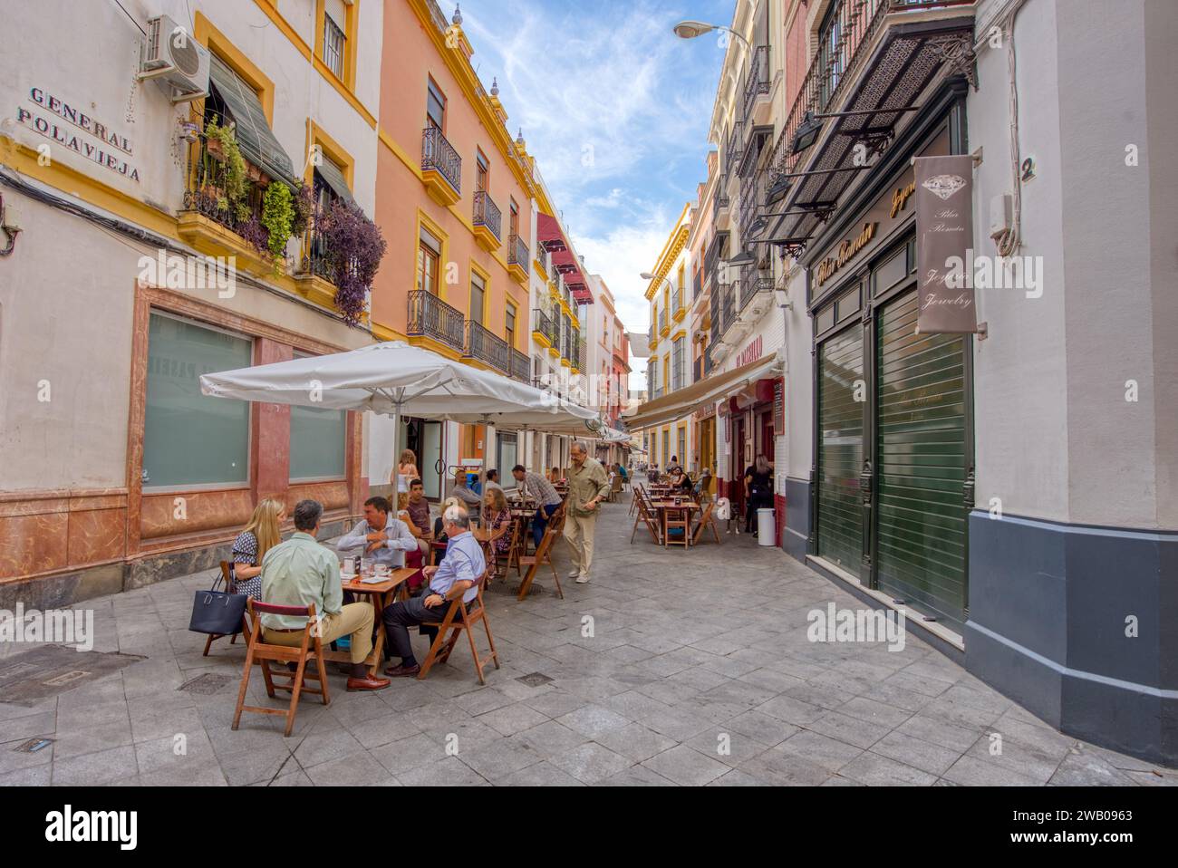 Cordoba, Spain - September 1, 2023: Busy street with restaurants and outdoor cafes in the historic town of Cordoba, Spain Stock Photo
