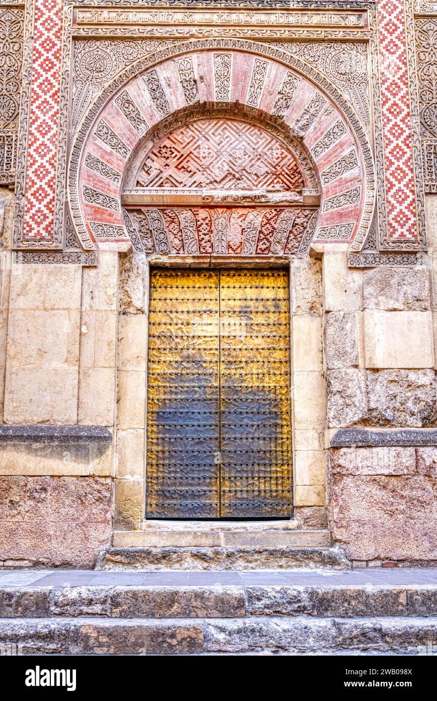 Ancient old moorish horseshoe shaped arch entry door in Spain Stock Photo