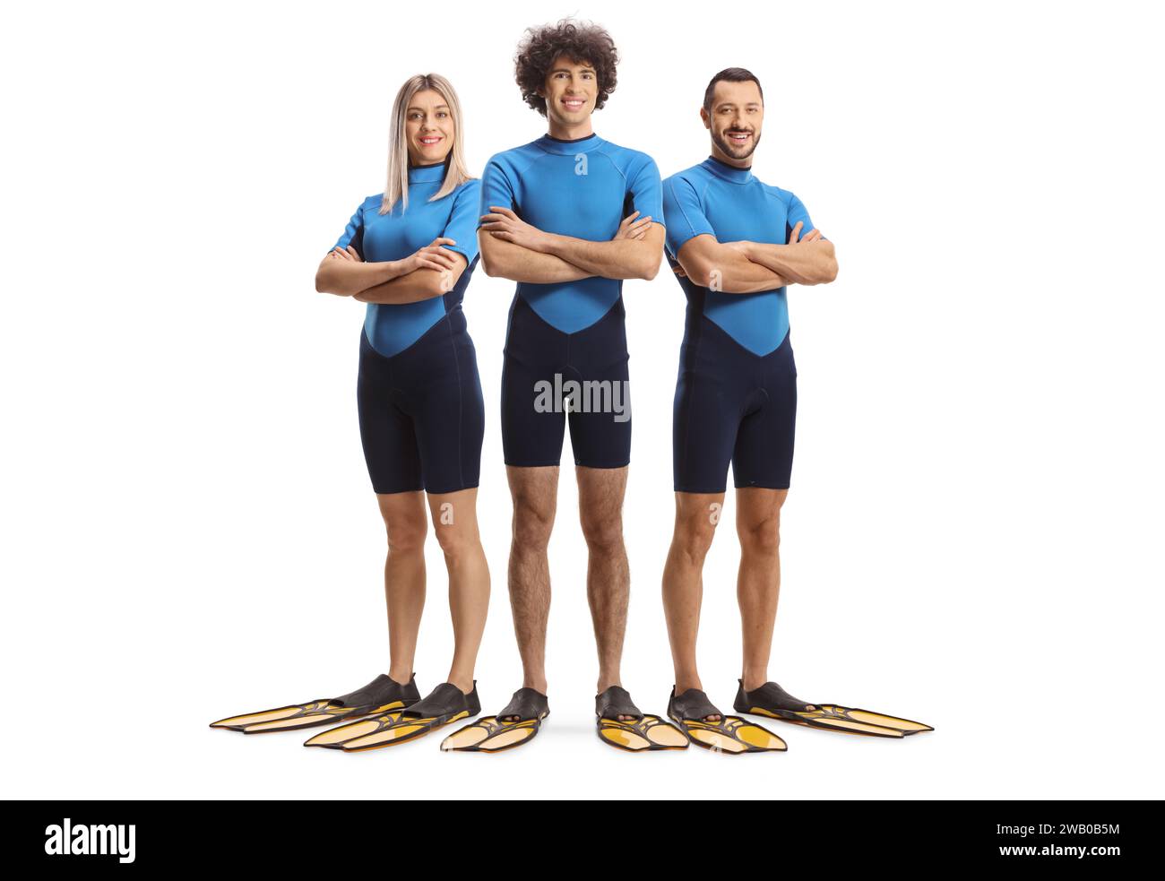 Full length portrait of team of divers in suits and fins isolated on white background Stock Photo