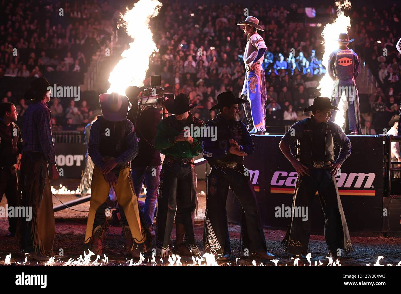 Pyrotechnics are set off as professional bull riders arrive into the ...