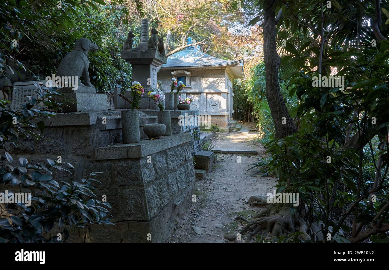 Nagoya, Japan - November 20, 2007: An altar with the statues of dogs and cat at the area which is dedicated to the dead pets near the pet cementery at Stock Photo