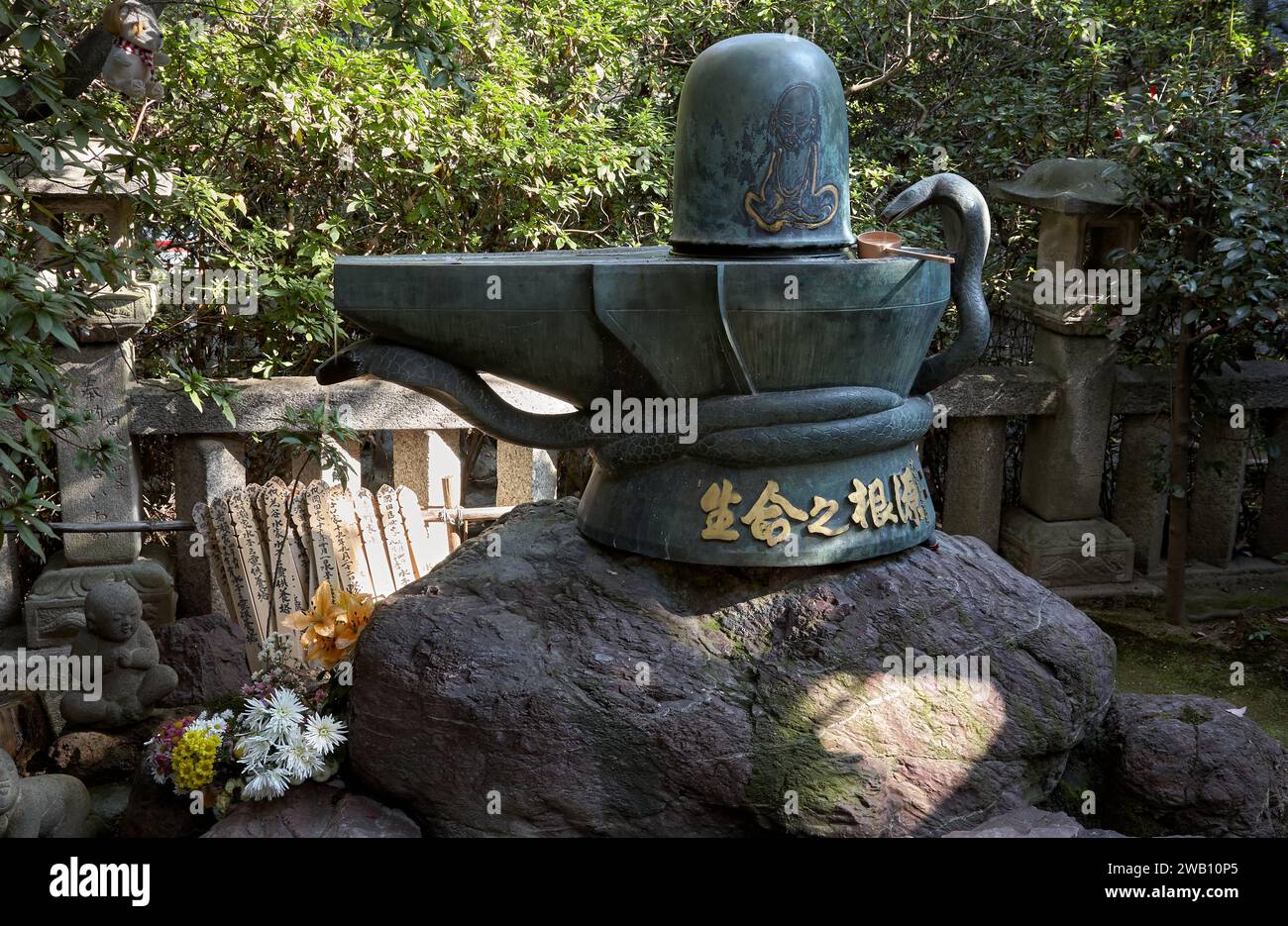 Nagoya, Japan - November 20, 2007: The bronze Shiva Linga in Toganji temple. The symbol of lingam-yoni, the union of the feminine and the masculine in Stock Photo