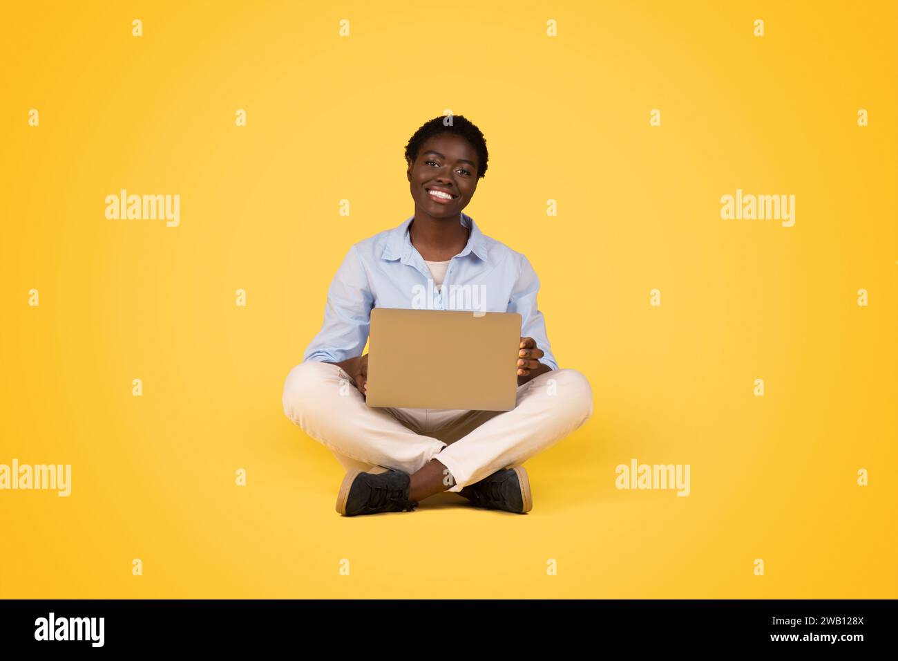 Black millennial woman sit hi-res stock photography and images - Alamy