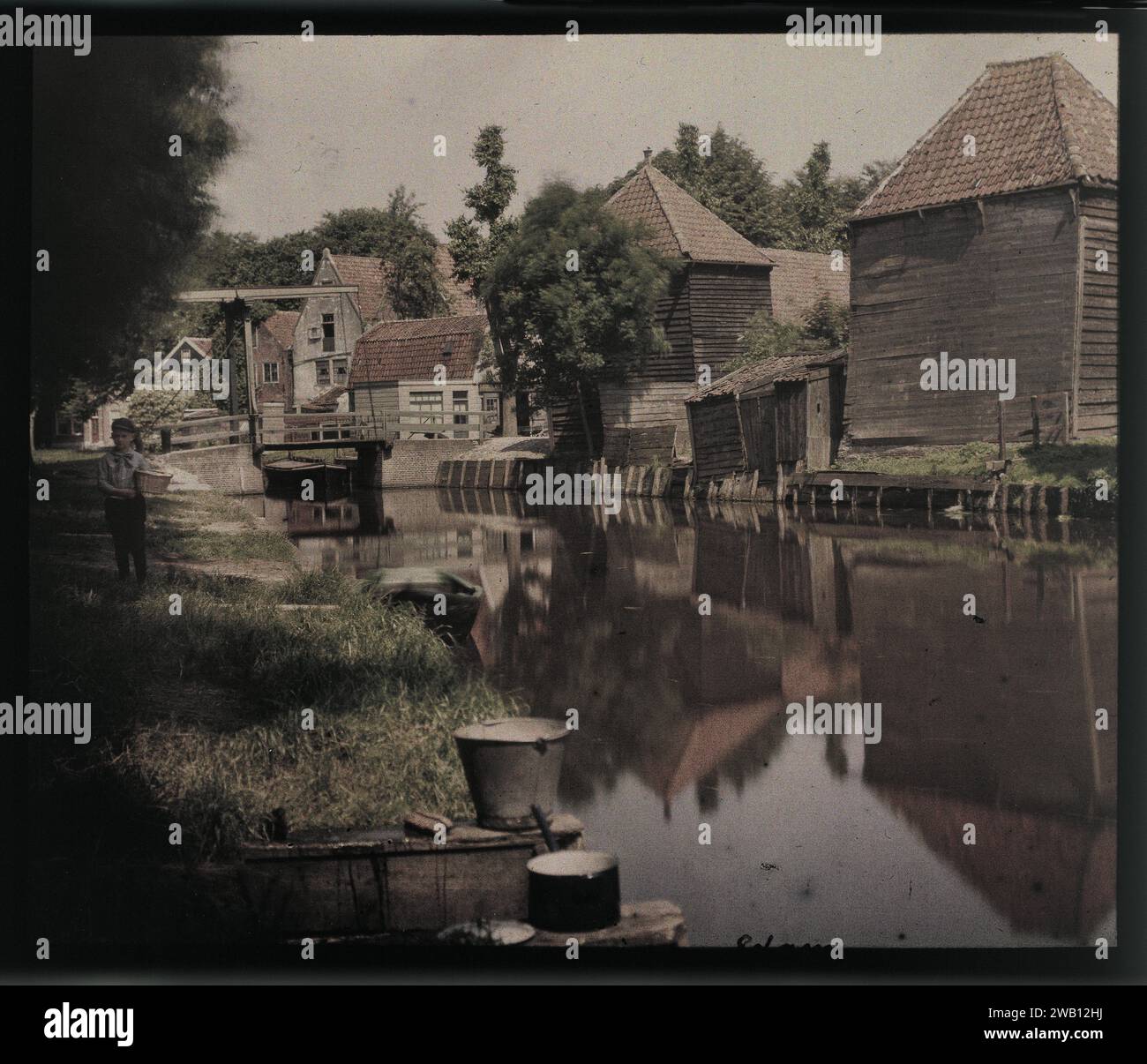 View of farms and sanding on the water, Edam, with a scaffolding in the ...