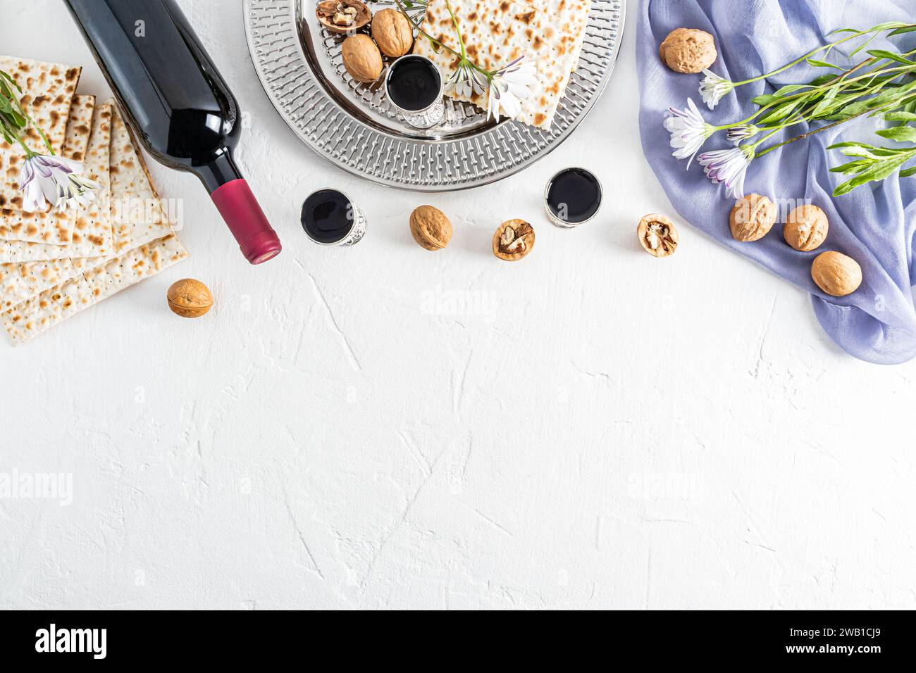 Concept of the Jewish holiday of Passover. Beautiful background with traditional holiday treats on white. A copy of the space. Flat layout. border Stock Photo