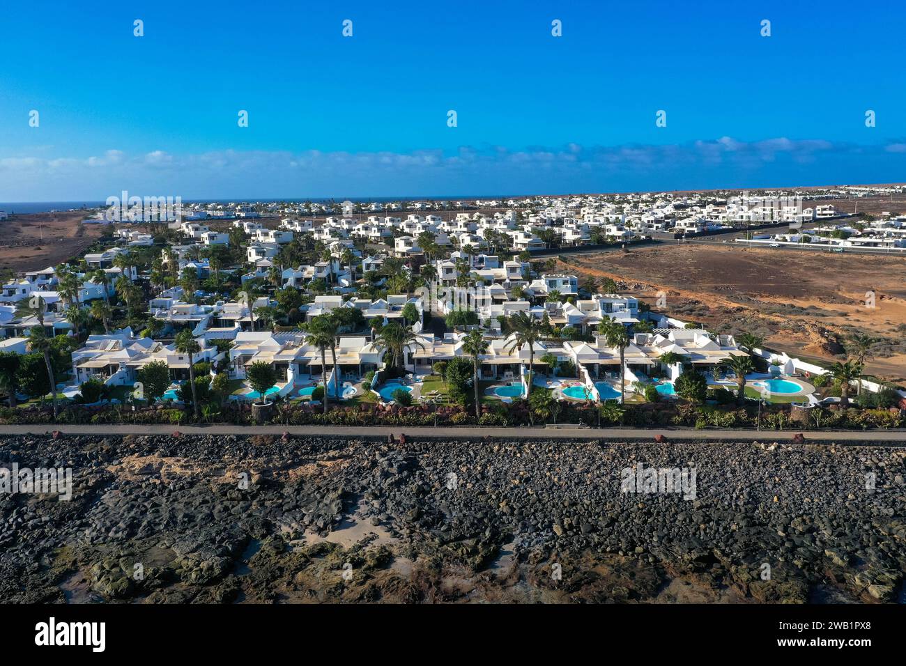 Playa Blanca coastline. Aerial drone panoramic view. Tourism and vacations concept. Flamingo beach  Lanzarote, Canary Islands, Spain. Stock Photo