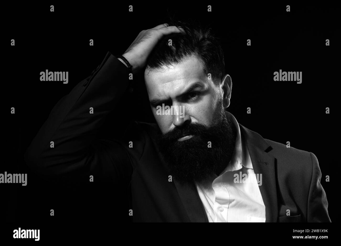 Man haircut, modern hair style. Portrait of male model with long hair