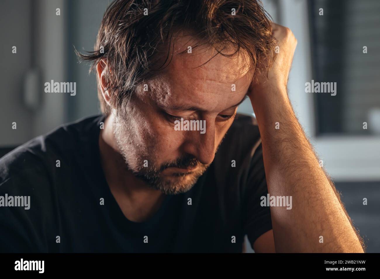 Overthinking or analysis paralysis, distraught anxious and depressive male thinking, mental health concept, selective focus Stock Photo