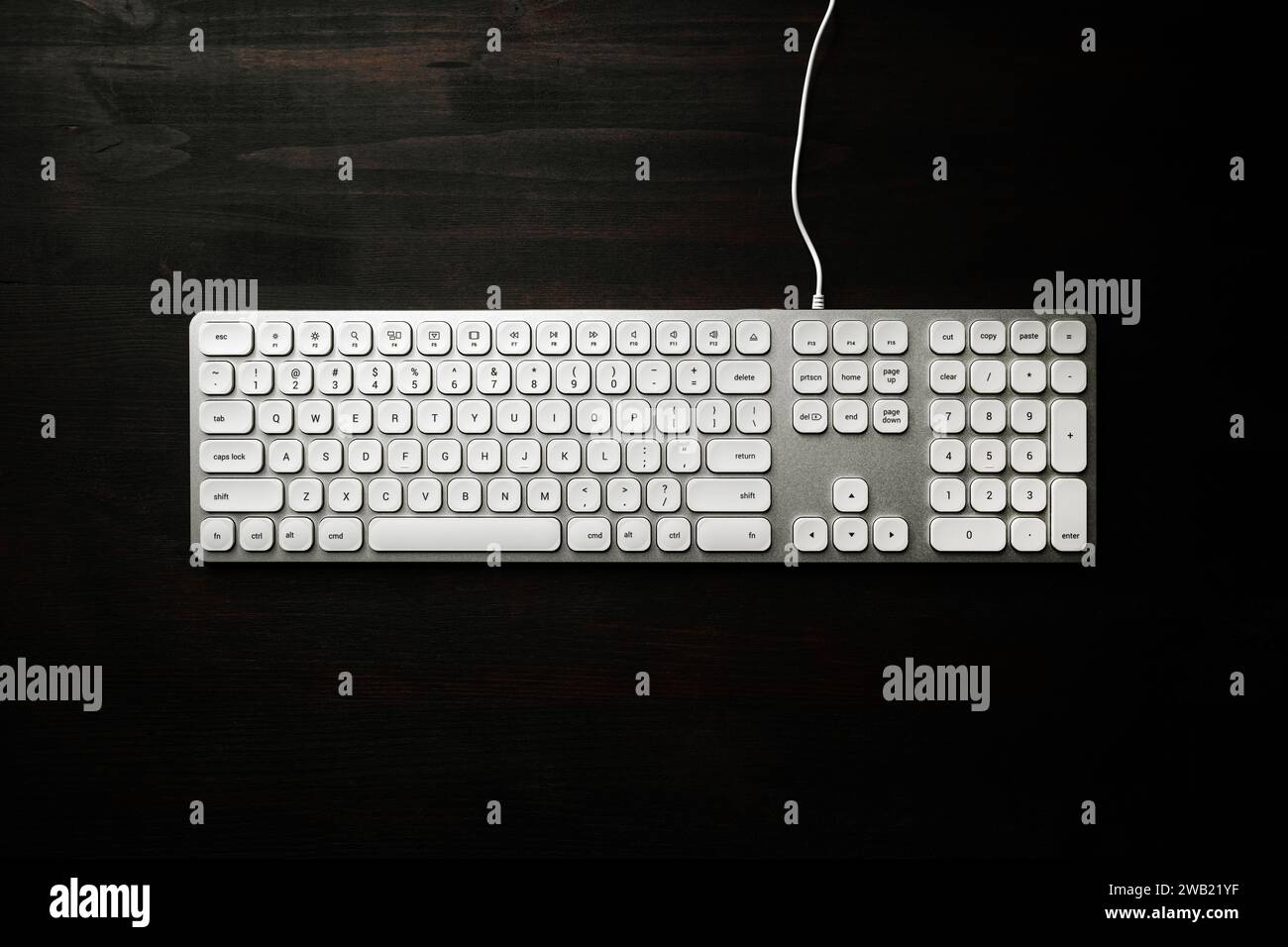 Top view of white computer keyboard on black office desk, copy space included Stock Photo