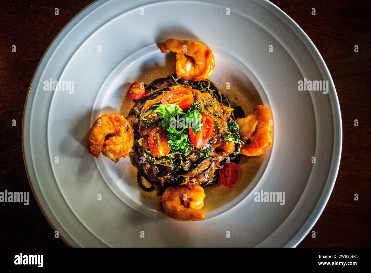 Spicy Seafood Spaghetti Aglio Olio with squid ink spaghetti, prawns