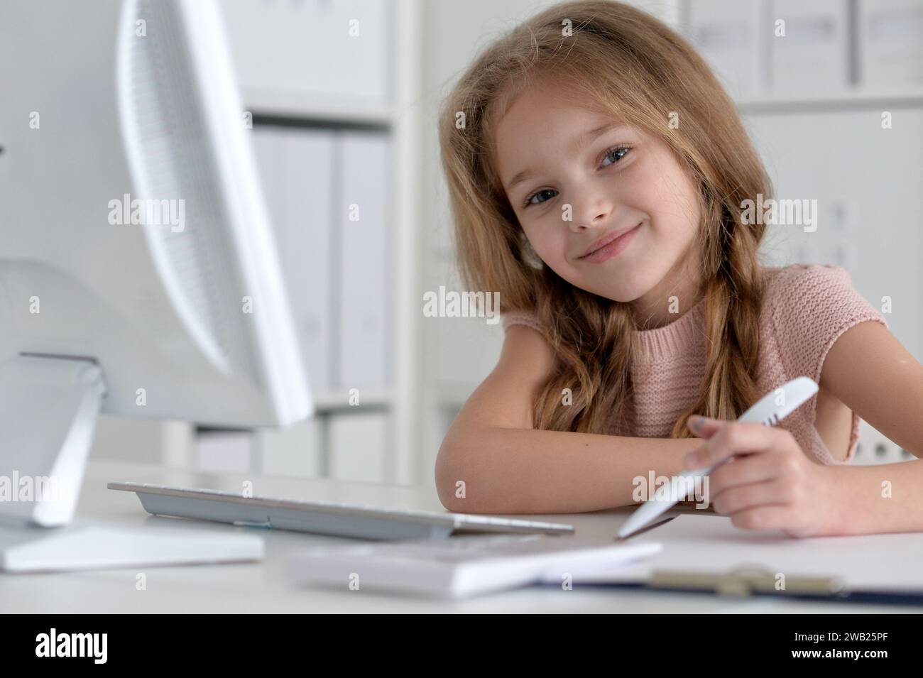 Cute and happy little girl children using laptop computer Stock Photo ...