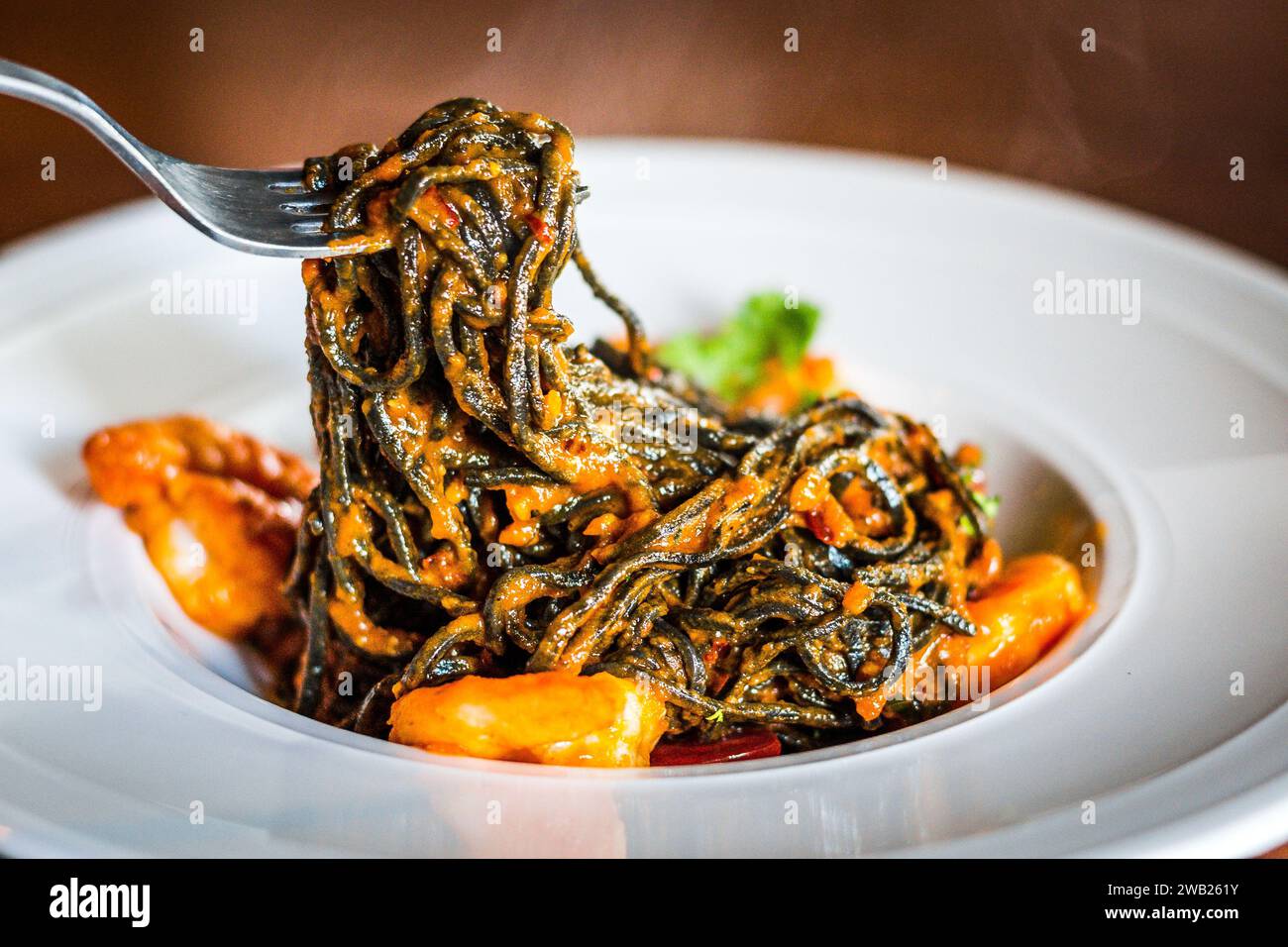 Spicy Seafood Spaghetti Aglio Olio with squid ink spaghetti, prawns